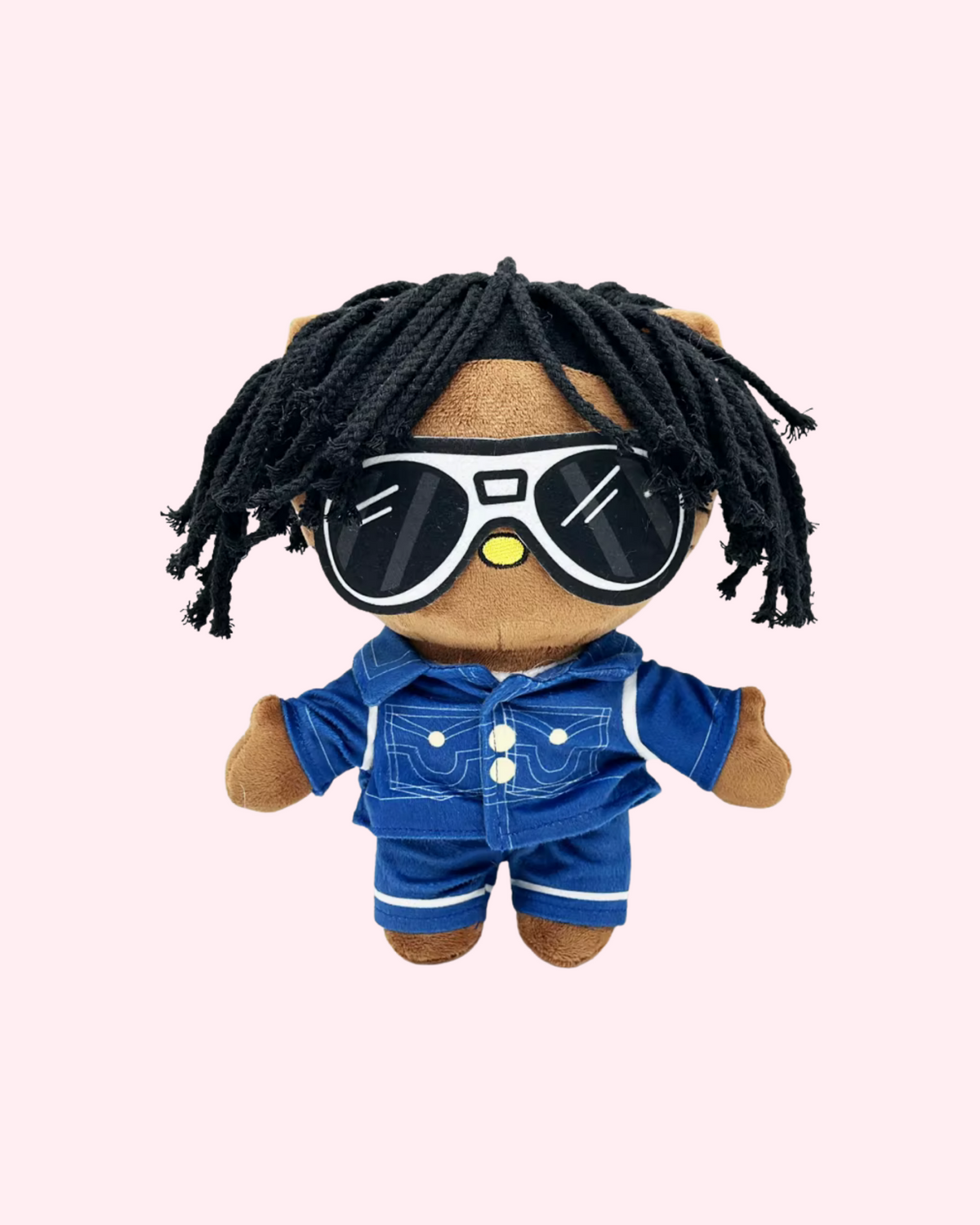 Front view of Chief Keef Hello Kitty plush with black yarn hair, oversized sunglasses and a blue outfit on a pale pink background.