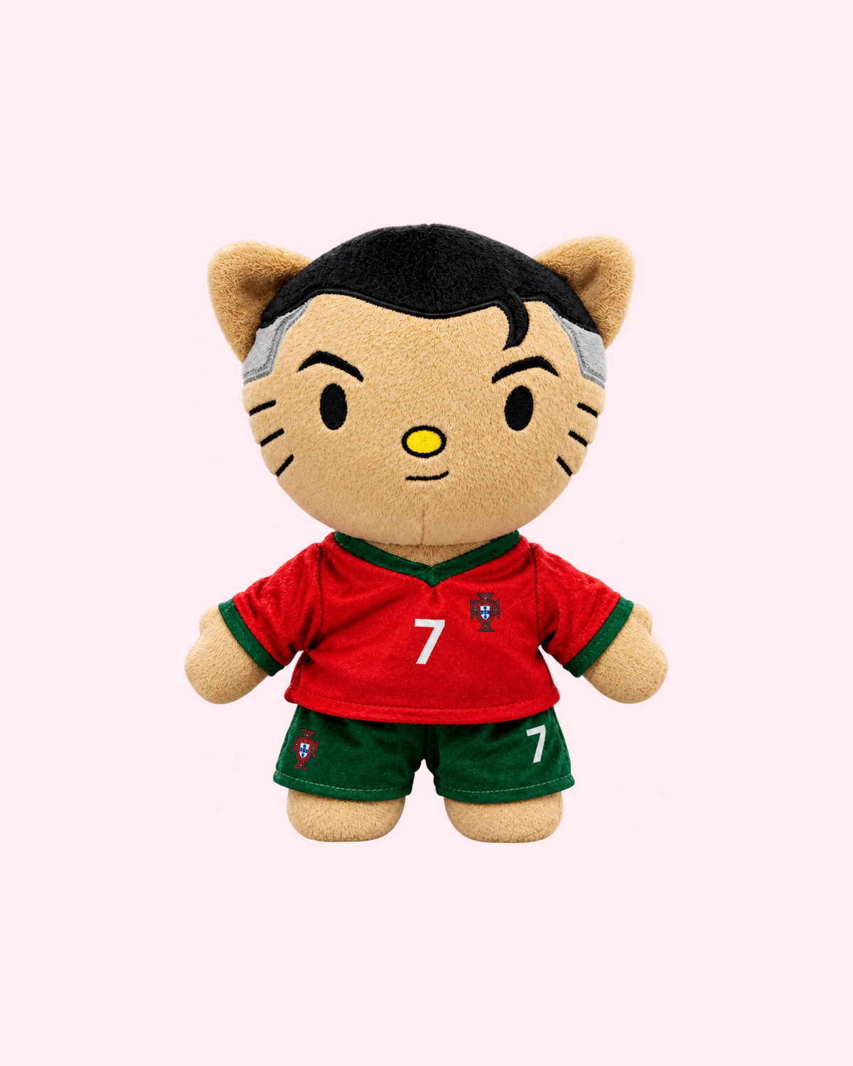 Front view of Cristiano Ronaldo Hello Kitty plush wearing a red Portugal number 7 shirt and green shorts on a pale pink background.