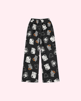 Front view of black Hello Kitty Halloween pajama pants with ghost, mummy and skeleton motifs