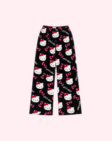 Back view of black Hello Kitty pajama pants with white character faces and pink bows