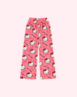 Back view of coral pink Hello Kitty pajama pants with white character faces and red bows