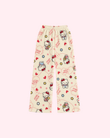 Back view of cream Hello Kitty pajama pants with red hearts, flowers and small bear motifs