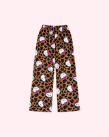 Mirrored back view of brown leopard-print pajama pants with white Hello Kitty faces and pink bows