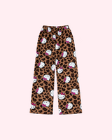 Front view of brown leopard-print pajama pants with white Hello Kitty faces and pink bows