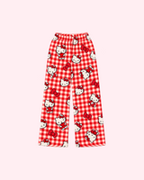 Front view of red and ivory gingham Hello Kitty pajama pants with red bows and heart motifs