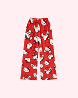Back view of red Hello Kitty pajama pants with white character faces and winged hearts