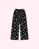 Mirrored back view of black pajama pants with white Hello Kitty outlines, bows and Hello Kitty lettering