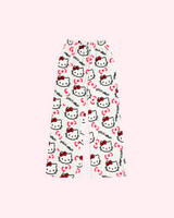 Back view of white Hello Kitty pajama pants with red character bows and pink bow motifs