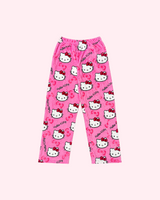 Front view of bright pink Hello Kitty pajama pants with white character faces and bow motifs