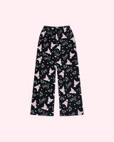Front view of black Kuromi pajama pants with pink character details, hearts and Kuromi lettering