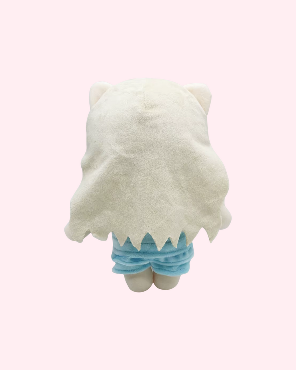 Back view of Lady Gaga Hello Kitty plush showing long pale hair and a light blue outfit on a pale pink background.