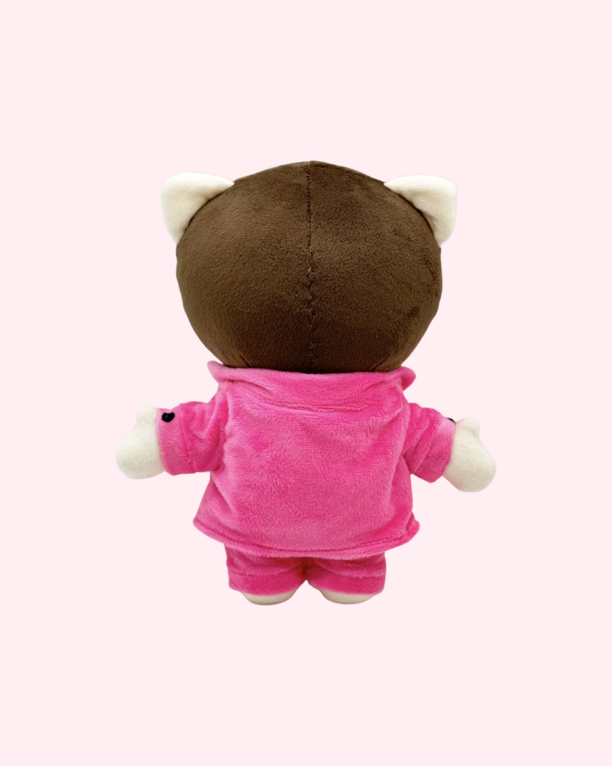 Back view of Mac Miller Hello Kitty plush with short brown hair and a pink suit, on a pale pink background.