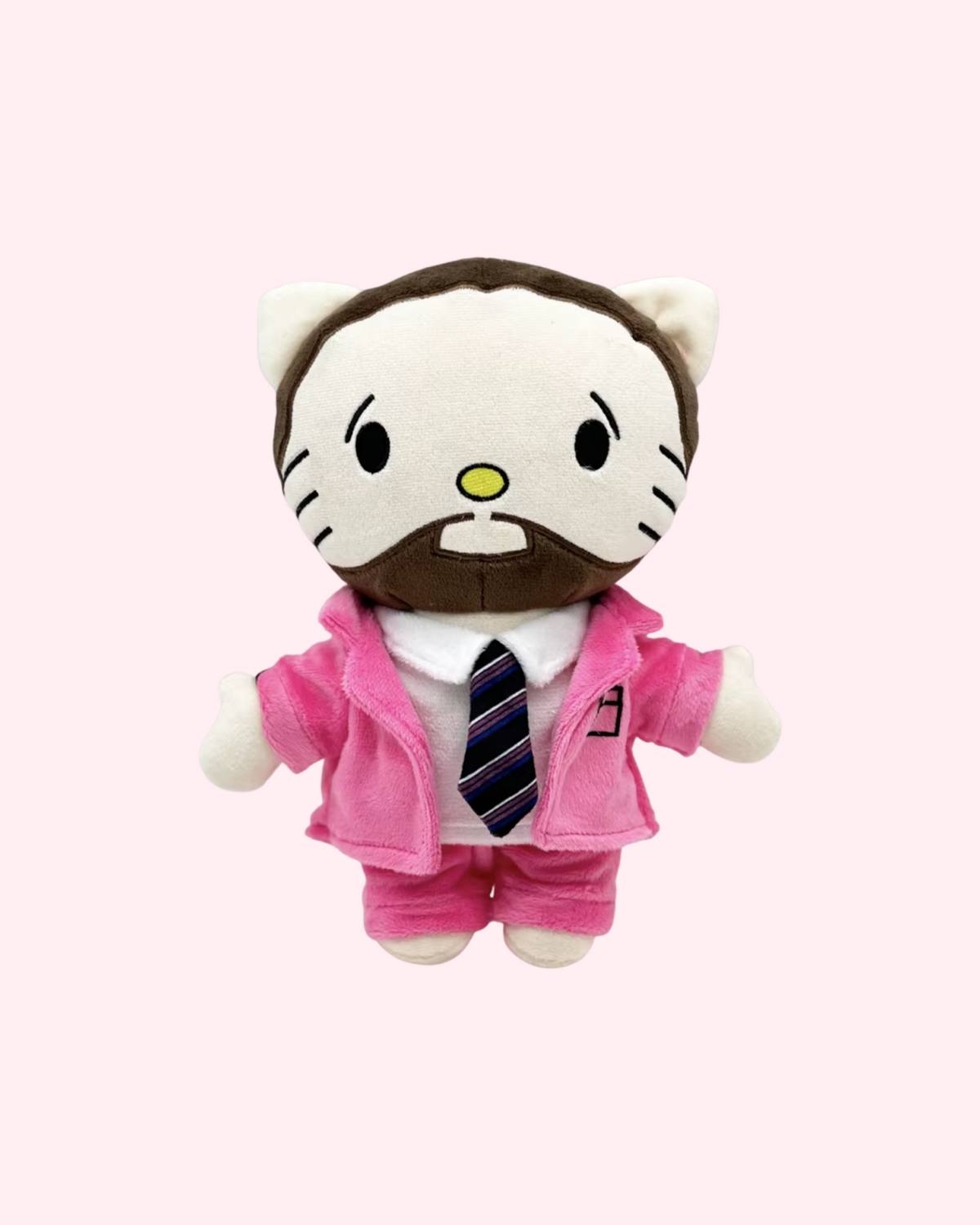Front view of Mac Miller Hello Kitty plush with a brown beard, a pink suit and a striped tie, on a pale pink background.