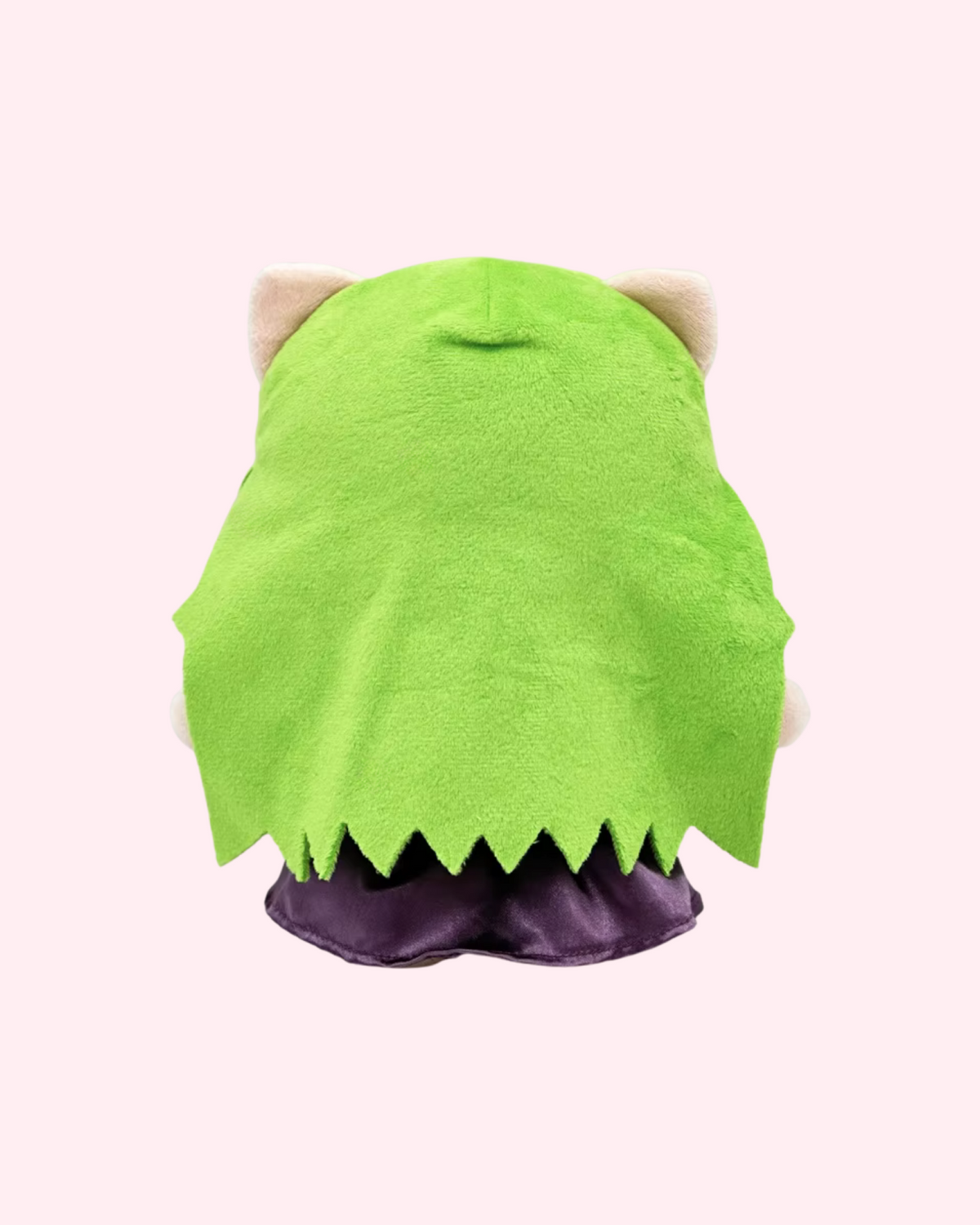 Back view of Melanie Martinez Hello Kitty plush showing long green hair and a purple dress on a pale pink background.