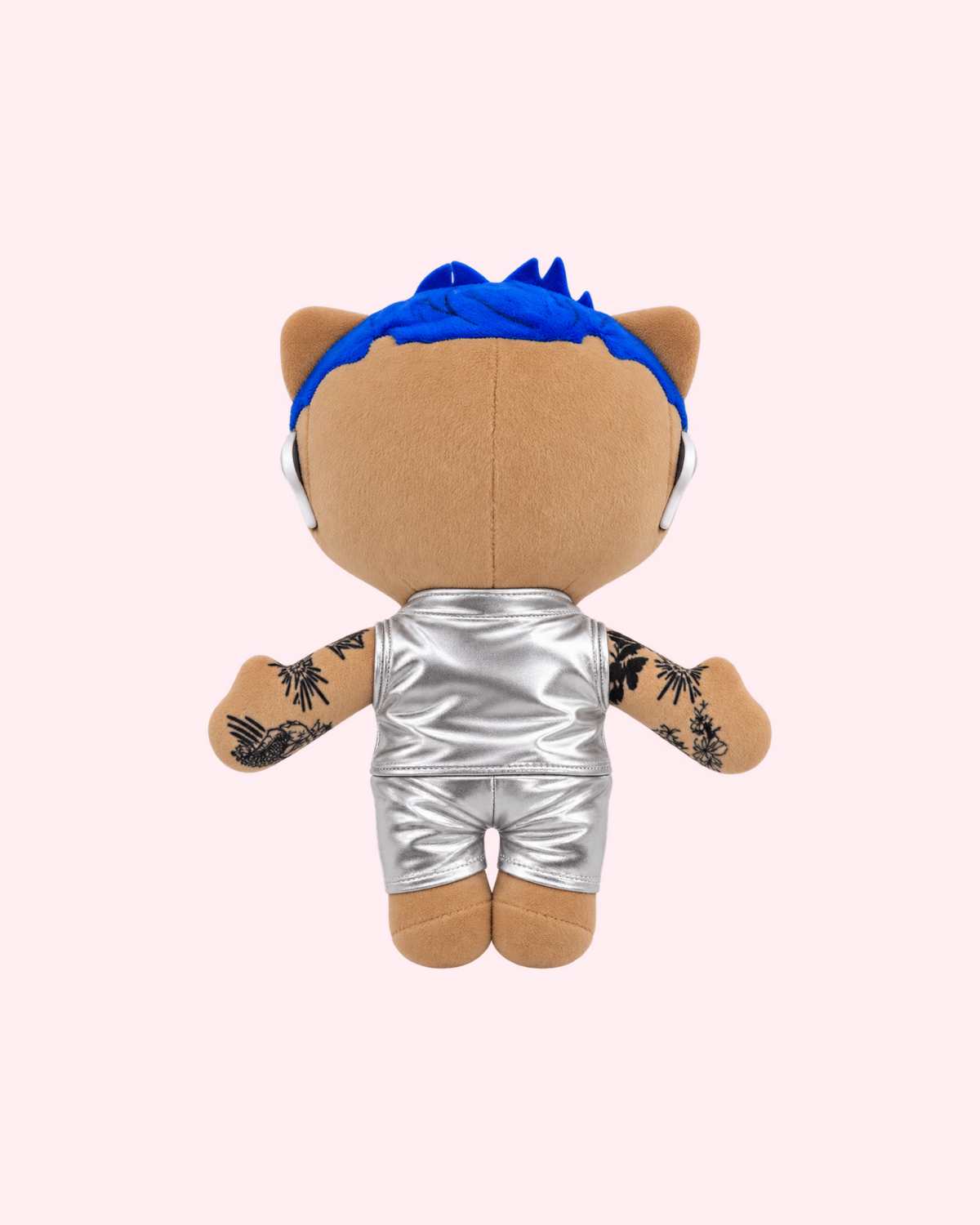 Back view of Rauw Alejandro Hello Kitty plush showing blue hair and a silver outfit on a pale pink background.