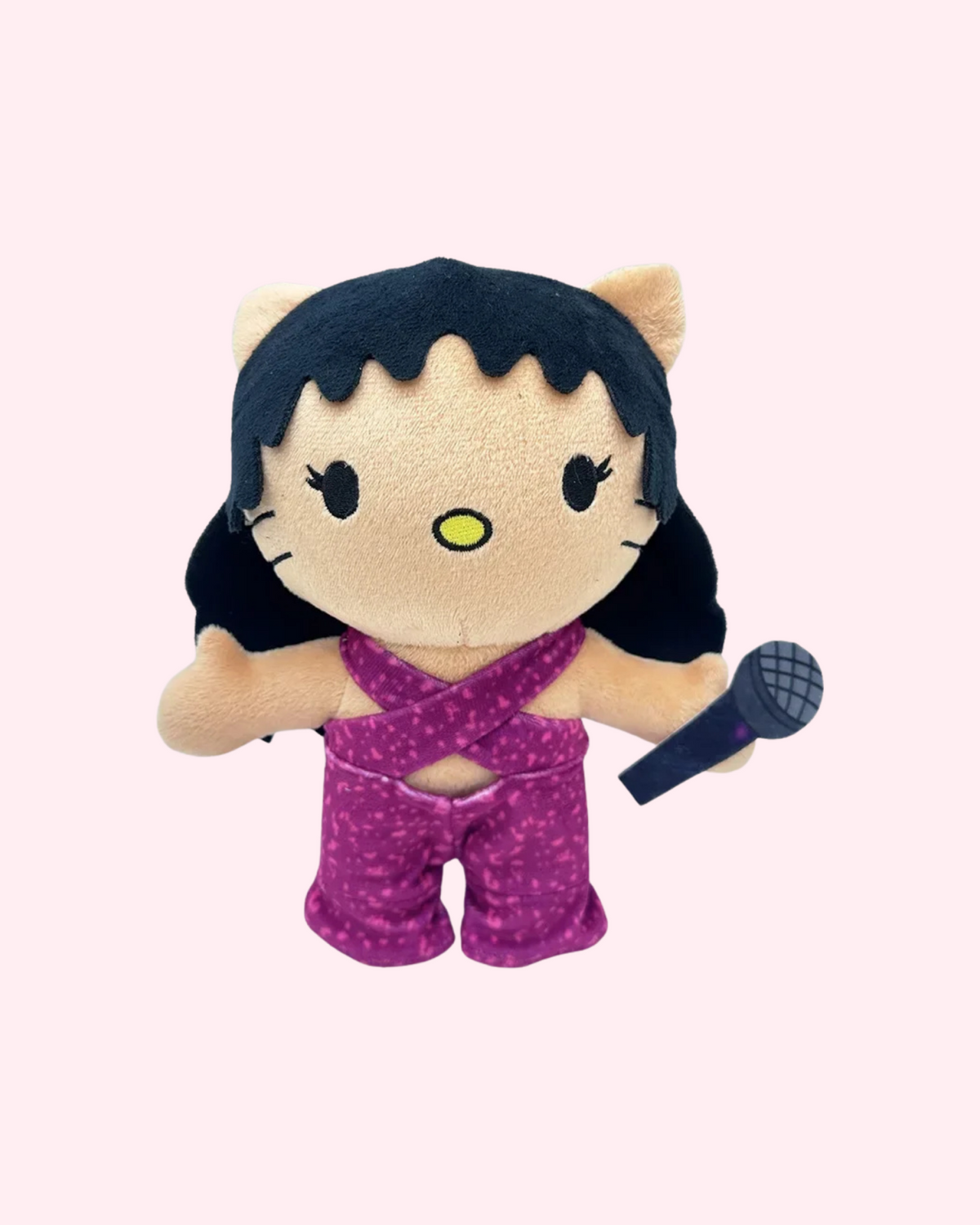 Front view of Selena Quintanilla Hello Kitty plush in a purple outfit holding a microphone on a pale pink background.