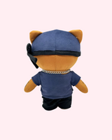 Back view of Ski Mask The Slump God Hello Kitty plush showing a blue cap, black bandana and dark outfit on a pale pink background.