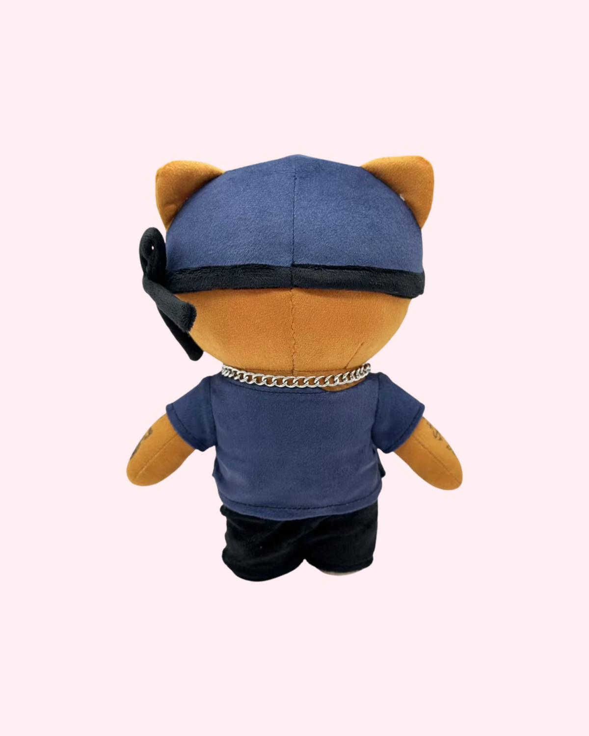 Back view of Ski Mask The Slump God Hello Kitty plush showing a blue cap, black bandana and dark outfit on a pale pink background.