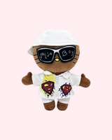 Front view of Soulja Boy Hello Kitty plush with a white cap, oversized sunglasses and a graphic white outfit on a pale pink background.