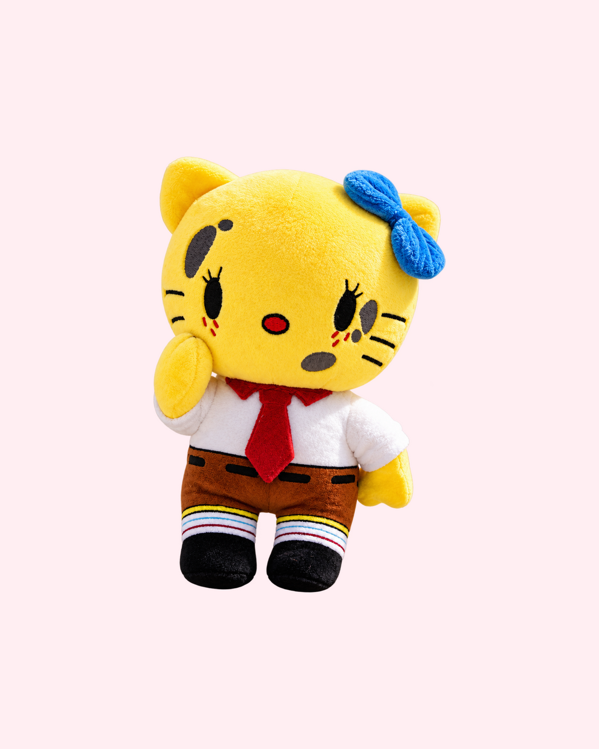 Front view of SpongeBob Hello Kitty plush with yellow fabric, a blue bow, a white shirt, a red tie and brown shorts, on a pale pink background.