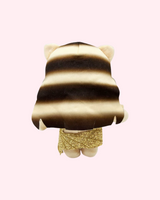 Back view of Taylor Swift Hello Kitty plush showing long hair and the back of the gold dress on a pale pink background.