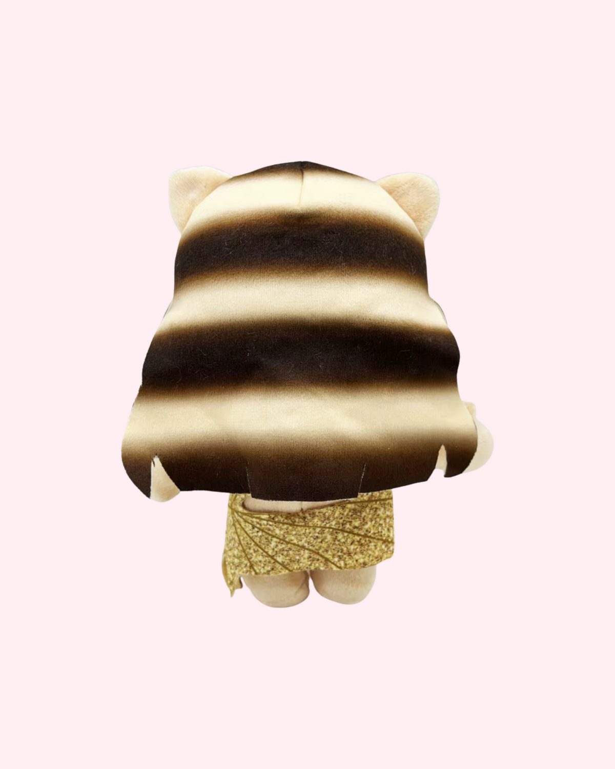 Back view of Taylor Swift Hello Kitty plush showing long hair and the back of the gold dress on a pale pink background.